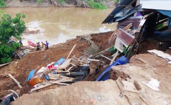 House collapses into river, one killed, child missing