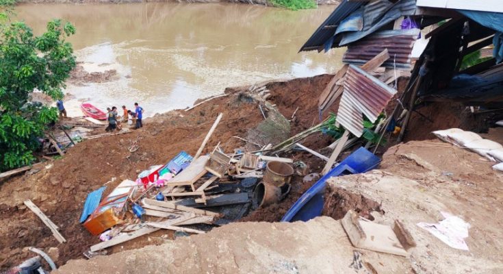 House collapses into river, one killed, child missing